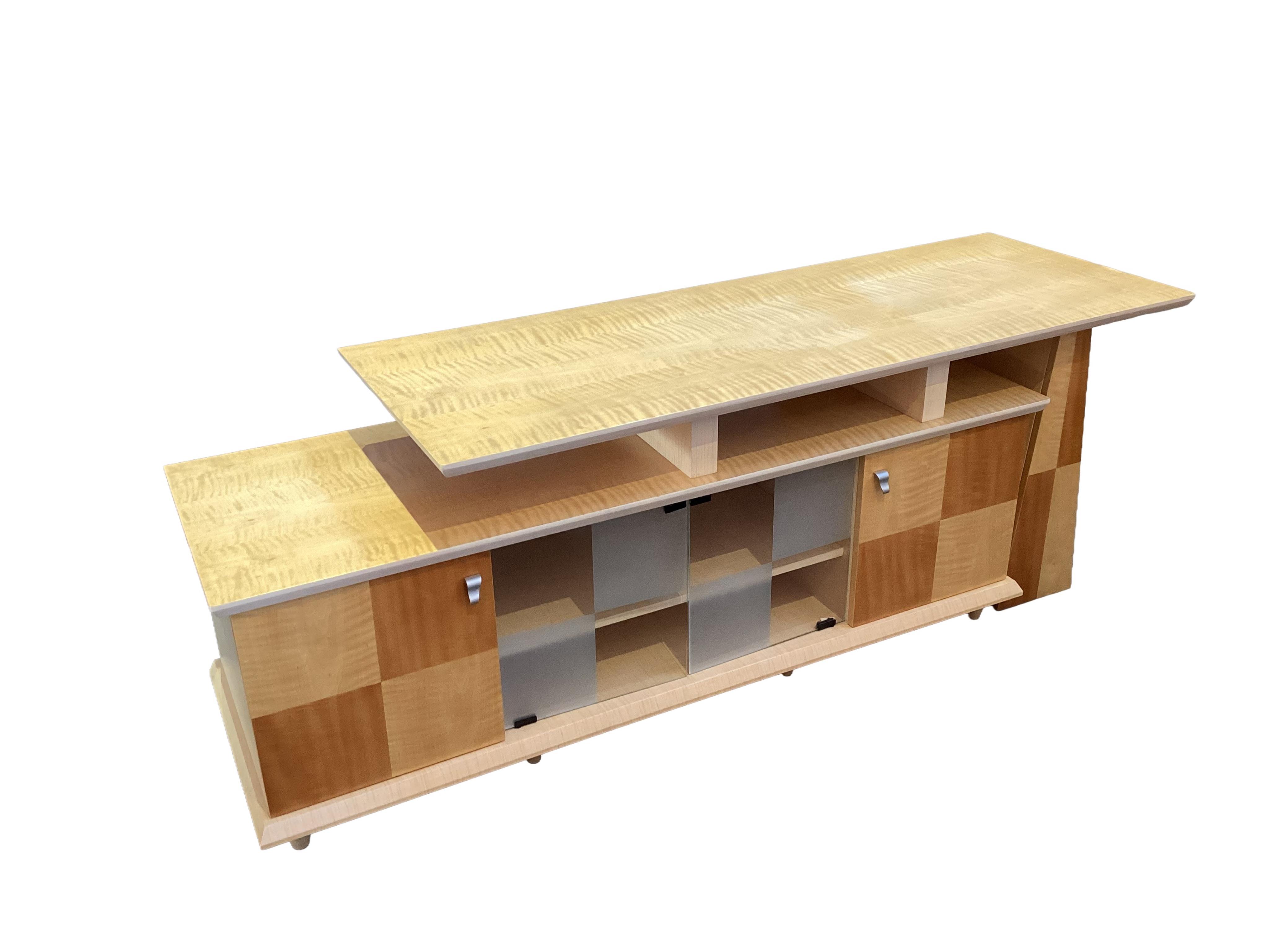 A Contemporary maple media unit, width 182cm, depth 56cm, height 66cm
